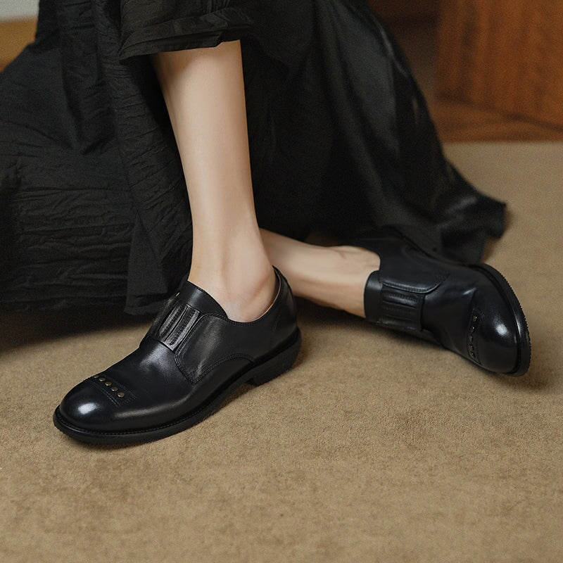 Retro Cowhide Round Toe Rivet Decorated Low Heel Loafers in Black/Brown