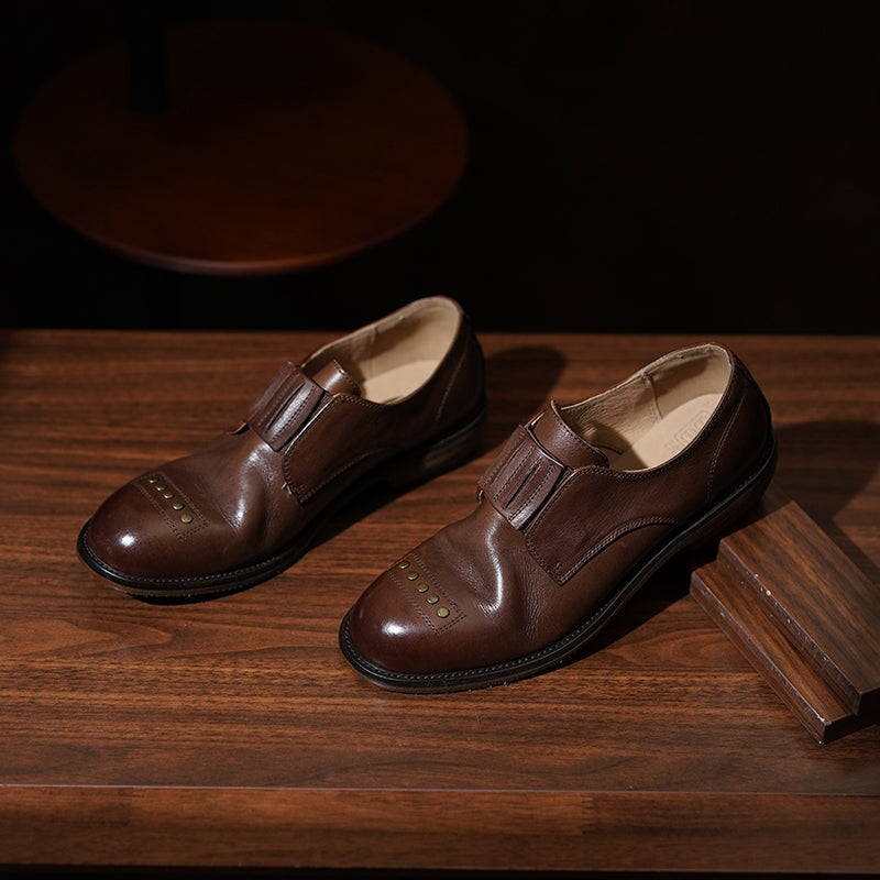 Retro Cowhide Round Toe Rivet Decorated Low Heel Loafers in Black/Brown