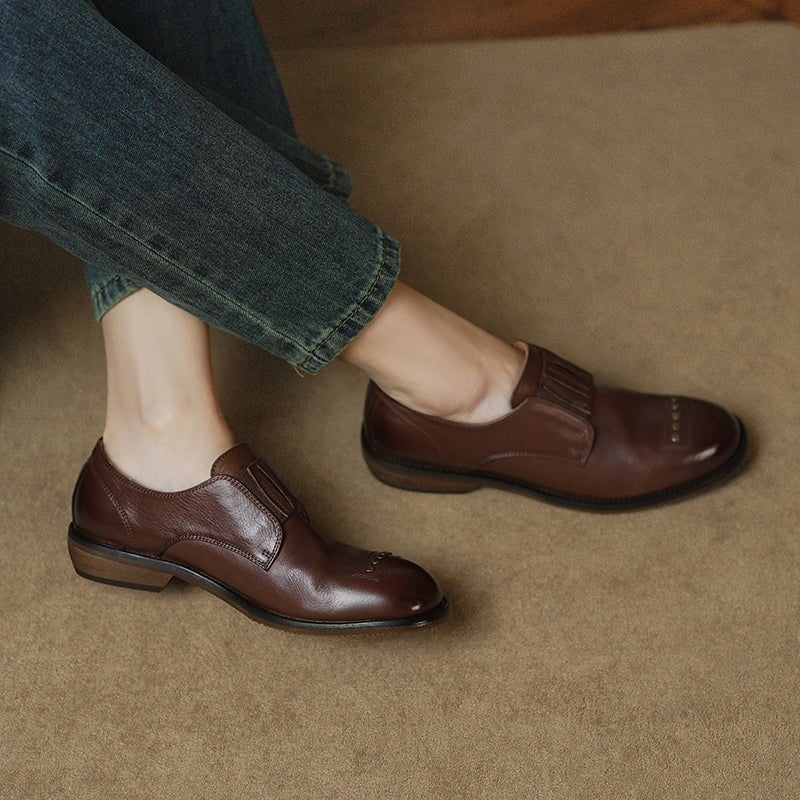 Retro Cowhide Round Toe Rivet Decorated Low Heel Loafers in Black/Brown