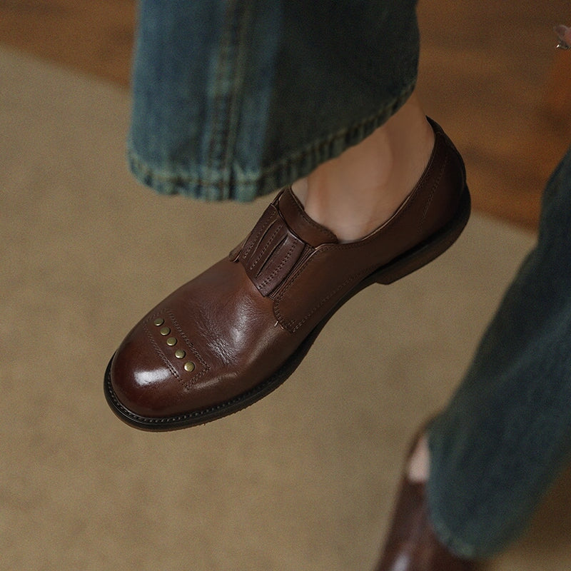 Retro Cowhide Round Toe Rivet Decorated Low Heel Loafers in Black/Brown